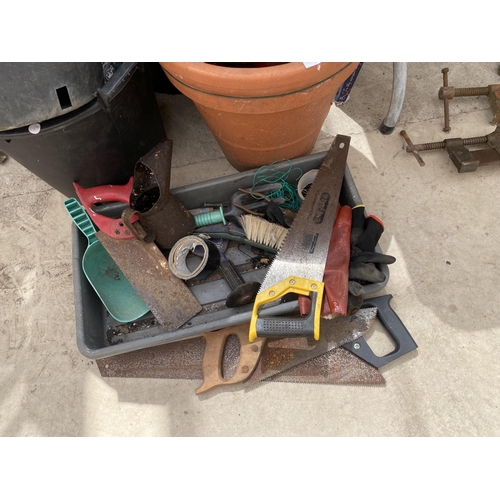 1874 - AN ASSORTMENT OF TOOLS AND GARDEN ITEMS TO INCLUDE PLANT POTS, WATERING CANS AND SAWS ETC