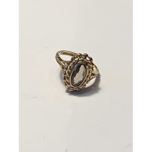 504A - A 9 CARAT GOLD RING WITH AN OVAL SOLITAIRE STONE SIZE K GROSS WEIGHT 2.58 GRAMS