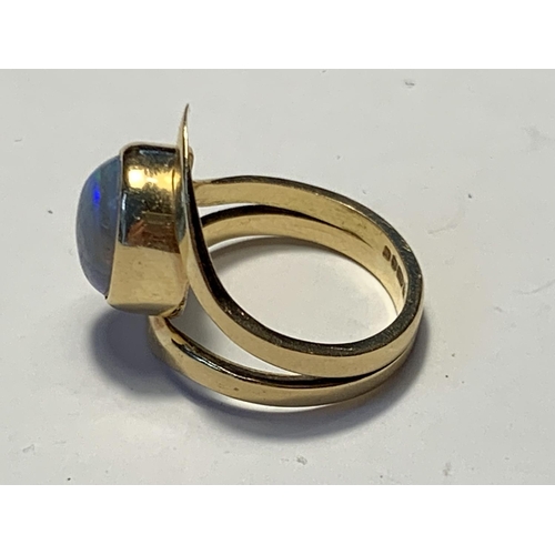 506A - AN 18 CARAT GOLD RING WITH AN OPAL SIZE K/L GROSS WEIGHT 6.33 GRAMS