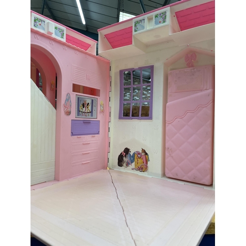 466 - A BARBIE HOUSE AND DOLLS