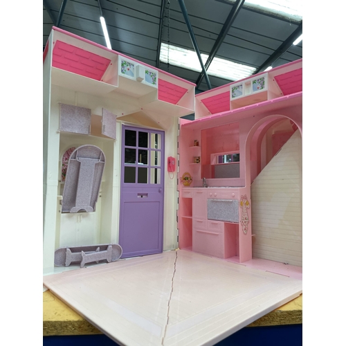 466 - A BARBIE HOUSE AND DOLLS