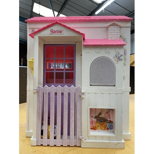 466 - A BARBIE HOUSE AND DOLLS