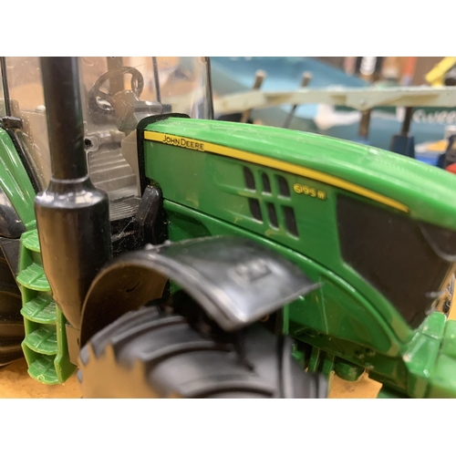 293 - AN ERTL BRITAINS JOHN DEERE TRACTOR 8191 WITH A KEENAN SYSTEM MUCK SPREADER