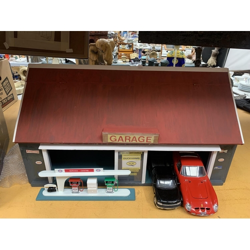 299 - A LARGE GARAGE WITH MOBILE PETROL PUMPS WITH A LARGE COLLECTION OF DIECAST MODEL VEHICLES