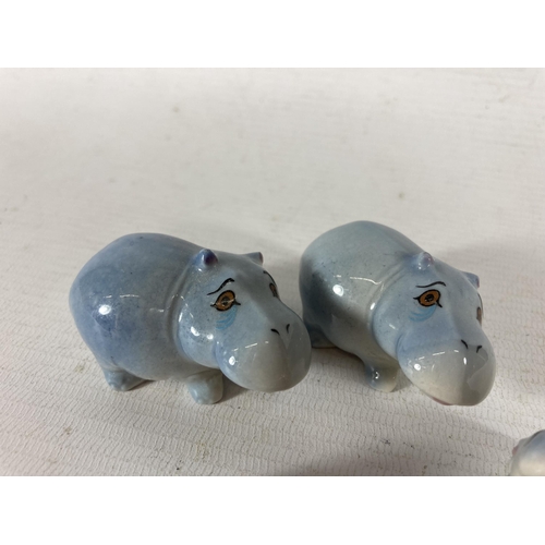 781 - TWO WADE HIPPO FAMILIES