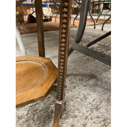 859 - A VINTAGE OAK CAKE STAND WITH THREE HEXAGONAL TIERS