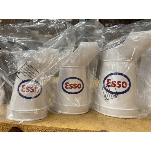 892 - A SET OF FIVE WHITE GRADUATED 'ESSO' OIL CANS