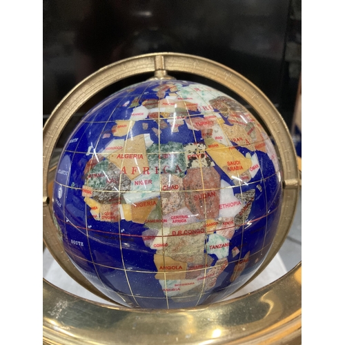 92 - A GEMSTONE GLOBE ON A BRASS BASE