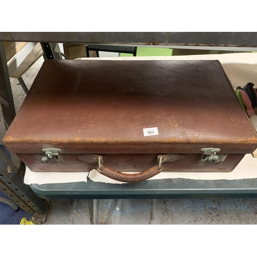 963 - A VINTAGE LEATHER LARGE SUITCASE WITH INITIALS E.C.