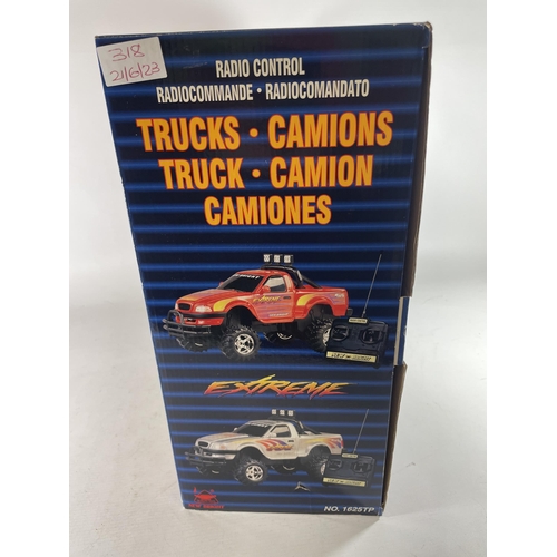 318 - TWO AS NEW AND BOXED RADIO CONTROLLED TRUCKS