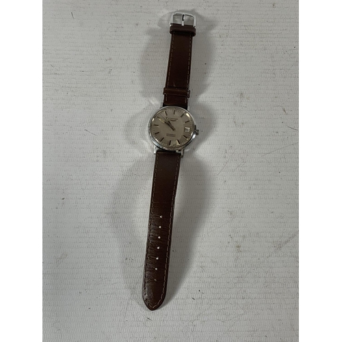 530A - A VINTAGE LONGINES CONQUEST AUTOMATIC WRIST WATCH WITH LEATHER STRAP SEEN WORKING BUT NO WARRANTY