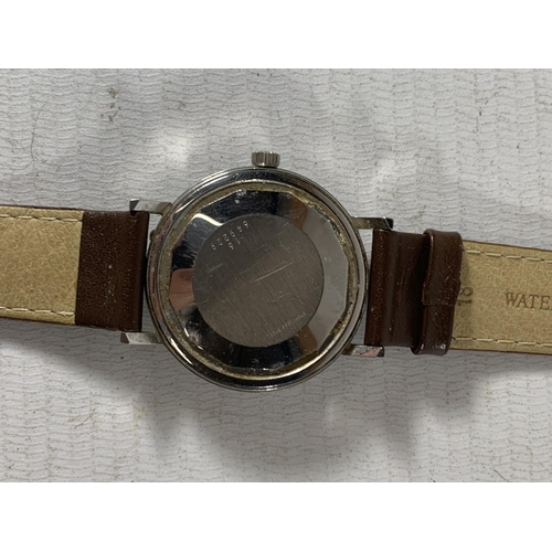 530A - A VINTAGE LONGINES CONQUEST AUTOMATIC WRIST WATCH WITH LEATHER STRAP SEEN WORKING BUT NO WARRANTY