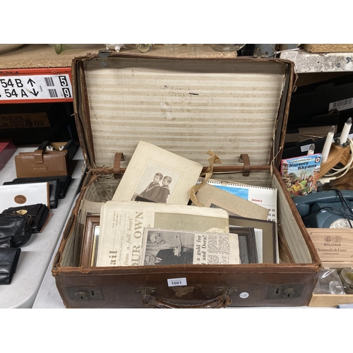 1001 - A VINTAGE LEATHER SUITCASE CONTAINING A QUANTITY OF EPHEMERA AND PHOTOGRAPHS