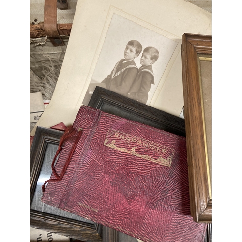 1001 - A VINTAGE LEATHER SUITCASE CONTAINING A QUANTITY OF EPHEMERA AND PHOTOGRAPHS