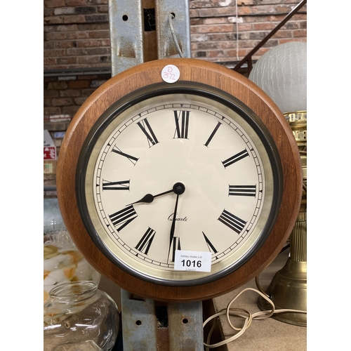 1016 - A WOODEN CASED WALL CLOCK