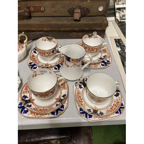 1023 - A CROWN DOUGLAS PART TEASET TO INCLUDE A CAKE PLATE, CREAM JUGS, SUGAR BOWLS, CUPS, SAUCERS AND SIDE... 