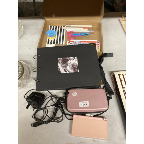 1043 - APINK NINTENDO DS LITE WITH CHARGER AND CASE, PHOTO ALBUM AND STATIONERY ITEMS