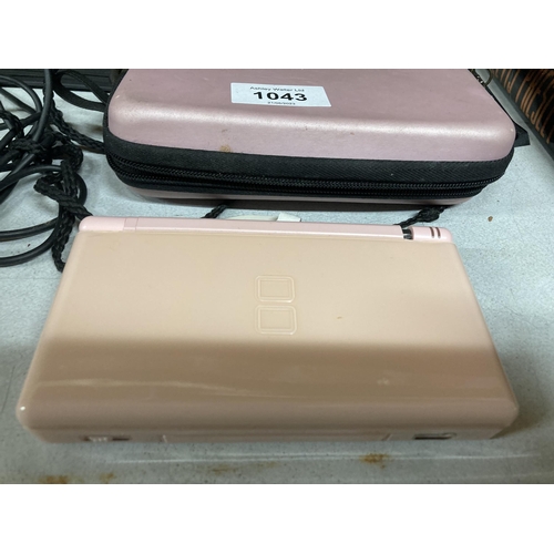 1043 - APINK NINTENDO DS LITE WITH CHARGER AND CASE, PHOTO ALBUM AND STATIONERY ITEMS