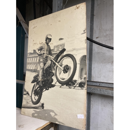 1047 - A LARGE PRINT OF ONE OF THE ROYAL ARTILLARY DISPLAY TEAM MOTORCYCLISTS