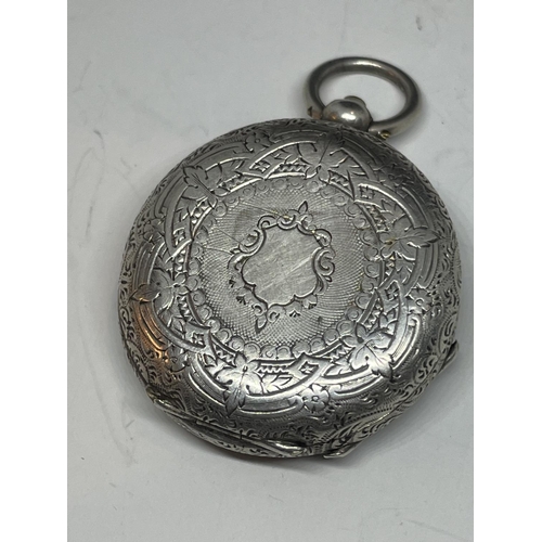 689 - AN ORNATE LADIES SILVER POCKET WATCH