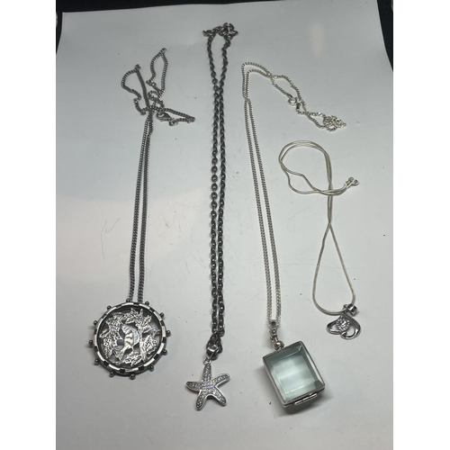 697 - FOUR SILVER NECKLACES WITH PENDANTS