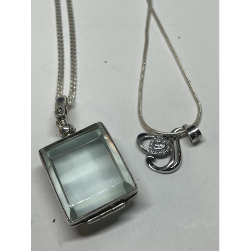 697 - FOUR SILVER NECKLACES WITH PENDANTS