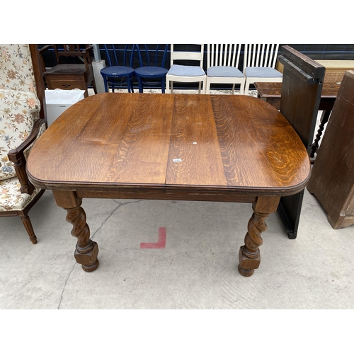 2928 - AN EARLY 20TH CENTURY OAK WIND-OUT DINING TABLE, 53X42