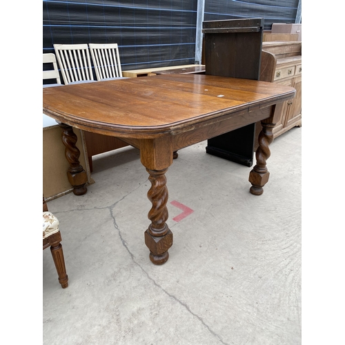 2928 - AN EARLY 20TH CENTURY OAK WIND-OUT DINING TABLE, 53X42