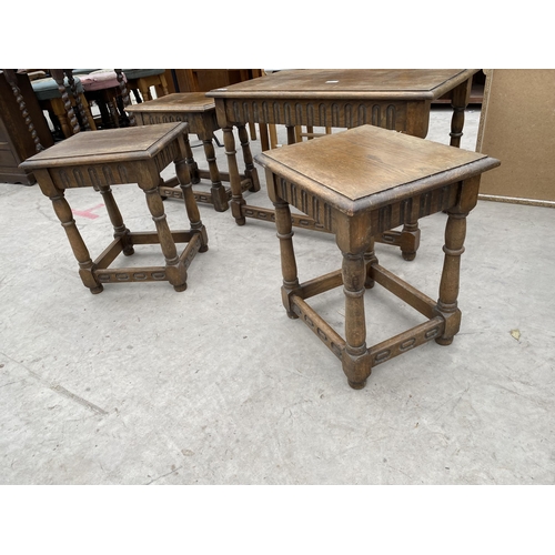 2930 - A NEST OF THREE OAK TABLES AND SINGLE BENTWOOD TABLE