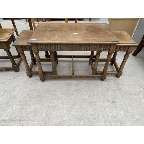 2930 - A NEST OF THREE OAK TABLES AND SINGLE BENTWOOD TABLE