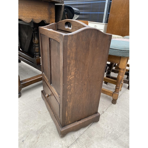 2932 - A MID 20TH CENTURY KEEP OAK TWO DIVISION MAGAZINE RACK WITH SINGLE DRAWER