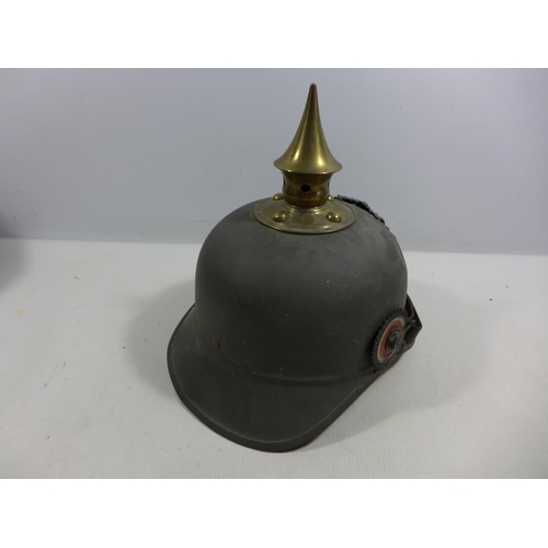 302 - A REPLICA IMPERIAL GERMAN PICKELHAUBE METAL HELMET WITH LEATHER LINING