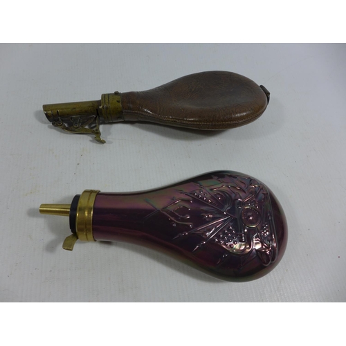 315 - AN ANTIQUE LEATHER AND BRASS SHOT FLASK AND A COPPER AND BRASS POWDER FLASK (2)