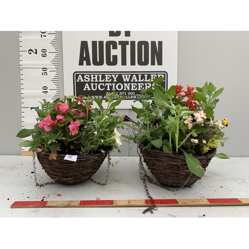 35 - TWO WICKER HANGING BASKETS PLANTED WITH SEASONAL BEDDING PLANTS + VAT