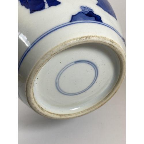 303 - A LATE 19TH / EARLY 20TH CENTURY QING CHINESE BLUE AND WHITE OVOID FORM VASE WITH FIGURES AND DRAGON... 