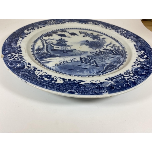 307 - A LARGE CHINESE EARTHENWARE POTTERY BLUE AND WHITE CHARGER WITH PAGODA LANDSCAPE DESIGN, DIAMETER 35... 