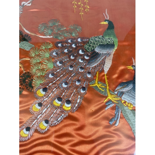 367 - A FRAMED ORIENTAL SILK EMBROIDERY OF PEACOCKS, 62 X 42CM