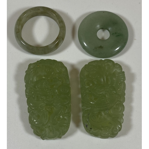 404 - A GROUP OF FOUR CHINESE JADEITE JADE STYLE ITEMS - TWO CARVED PENDANT PLAQUES AND TWO RINGS