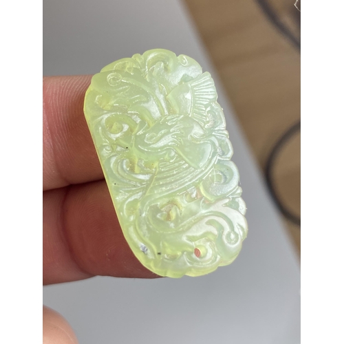 404 - A GROUP OF FOUR CHINESE JADEITE JADE STYLE ITEMS - TWO CARVED PENDANT PLAQUES AND TWO RINGS