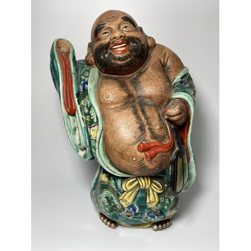 453 - A LARGE JAPANESE MEIJI PERIOD (1868-1912) POTTERY MODEL OF HOTEI WEARING CHINESE DRAGON DESIGN ROBE,... 