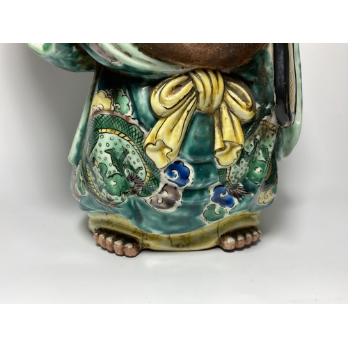 453 - A LARGE JAPANESE MEIJI PERIOD (1868-1912) POTTERY MODEL OF HOTEI WEARING CHINESE DRAGON DESIGN ROBE,... 