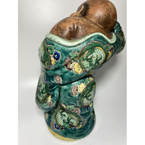 453 - A LARGE JAPANESE MEIJI PERIOD (1868-1912) POTTERY MODEL OF HOTEI WEARING CHINESE DRAGON DESIGN ROBE,... 