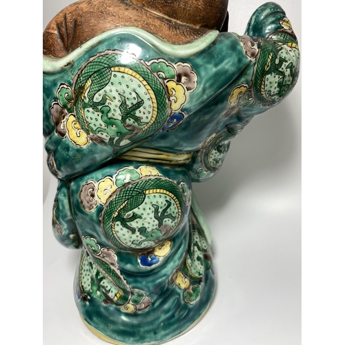 453 - A LARGE JAPANESE MEIJI PERIOD (1868-1912) POTTERY MODEL OF HOTEI WEARING CHINESE DRAGON DESIGN ROBE,... 