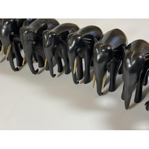 466 - A SET OF FOURTEEN ANTIQUE EBONISED / EBONY ELEPHANTS, LARGEST 16CM, SMALLEST 2CM