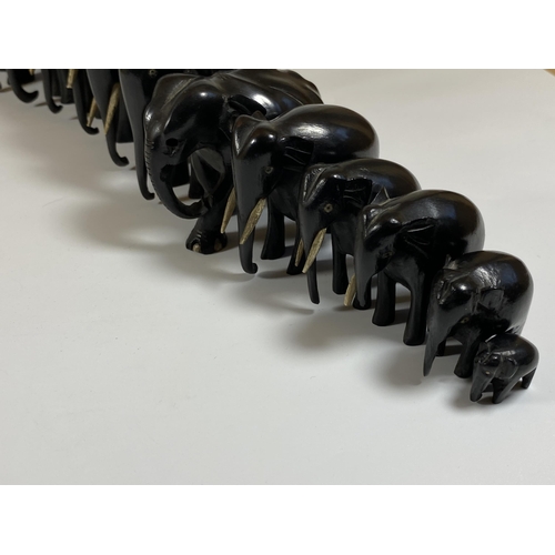 466 - A SET OF FOURTEEN ANTIQUE EBONISED / EBONY ELEPHANTS, LARGEST 16CM, SMALLEST 2CM