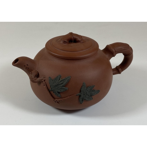 469 - A CHINESE YIXING CLAY TEAPOT WITH FLORAL RELIEF MOULDED DESIGN, SEAL MARK TO BASE AND LID INNER, HEI... 