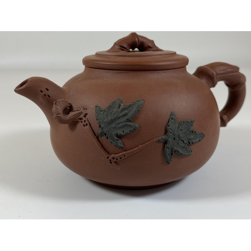 469 - A CHINESE YIXING CLAY TEAPOT WITH FLORAL RELIEF MOULDED DESIGN, SEAL MARK TO BASE AND LID INNER, HEI... 