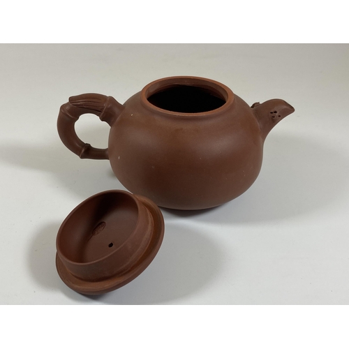 469 - A CHINESE YIXING CLAY TEAPOT WITH FLORAL RELIEF MOULDED DESIGN, SEAL MARK TO BASE AND LID INNER, HEI... 