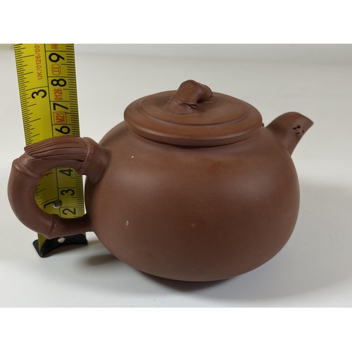 469 - A CHINESE YIXING CLAY TEAPOT WITH FLORAL RELIEF MOULDED DESIGN, SEAL MARK TO BASE AND LID INNER, HEI... 