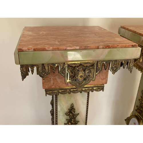 1 - AN IMPRESSIVE PAIR OF ITALIAN ONYX AND MARBLE PEDESTAL COLUMNS WITH SWIVEL FIZEL SQUARE TOPS AND BRO... 